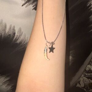 Real ethically sourced opossum tooth wire wrapped necklace with small star charm